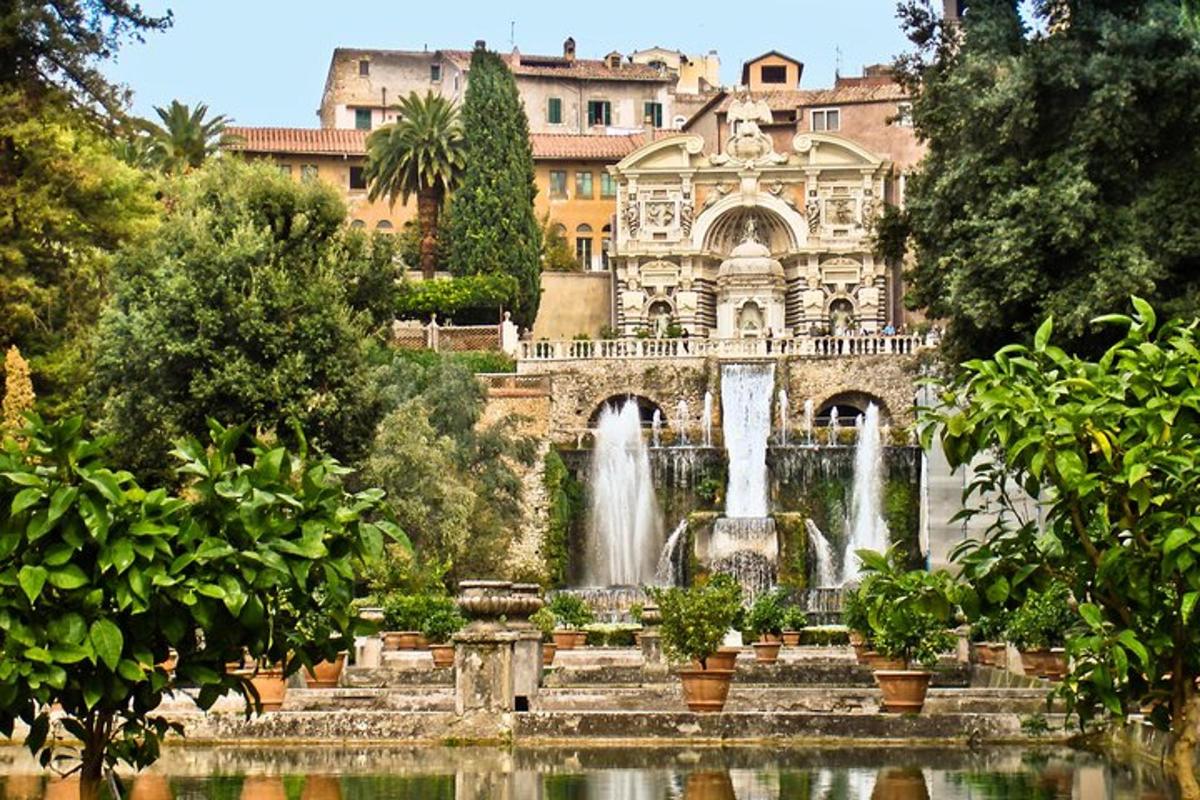 a fountain in front of a building with a waterfall