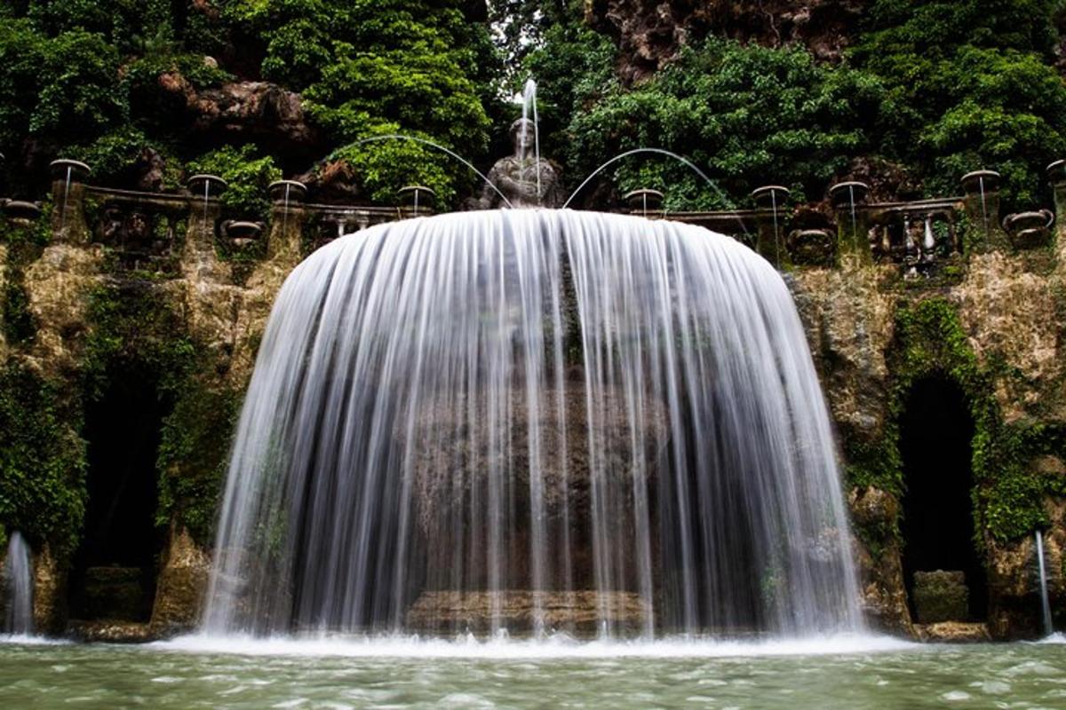 a waterfall in the middle of a body of water