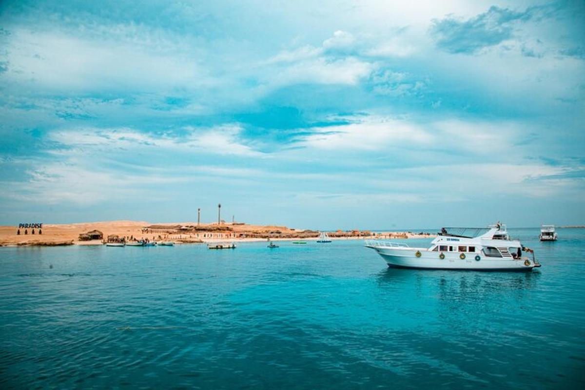 a white boat in the water on a body of water