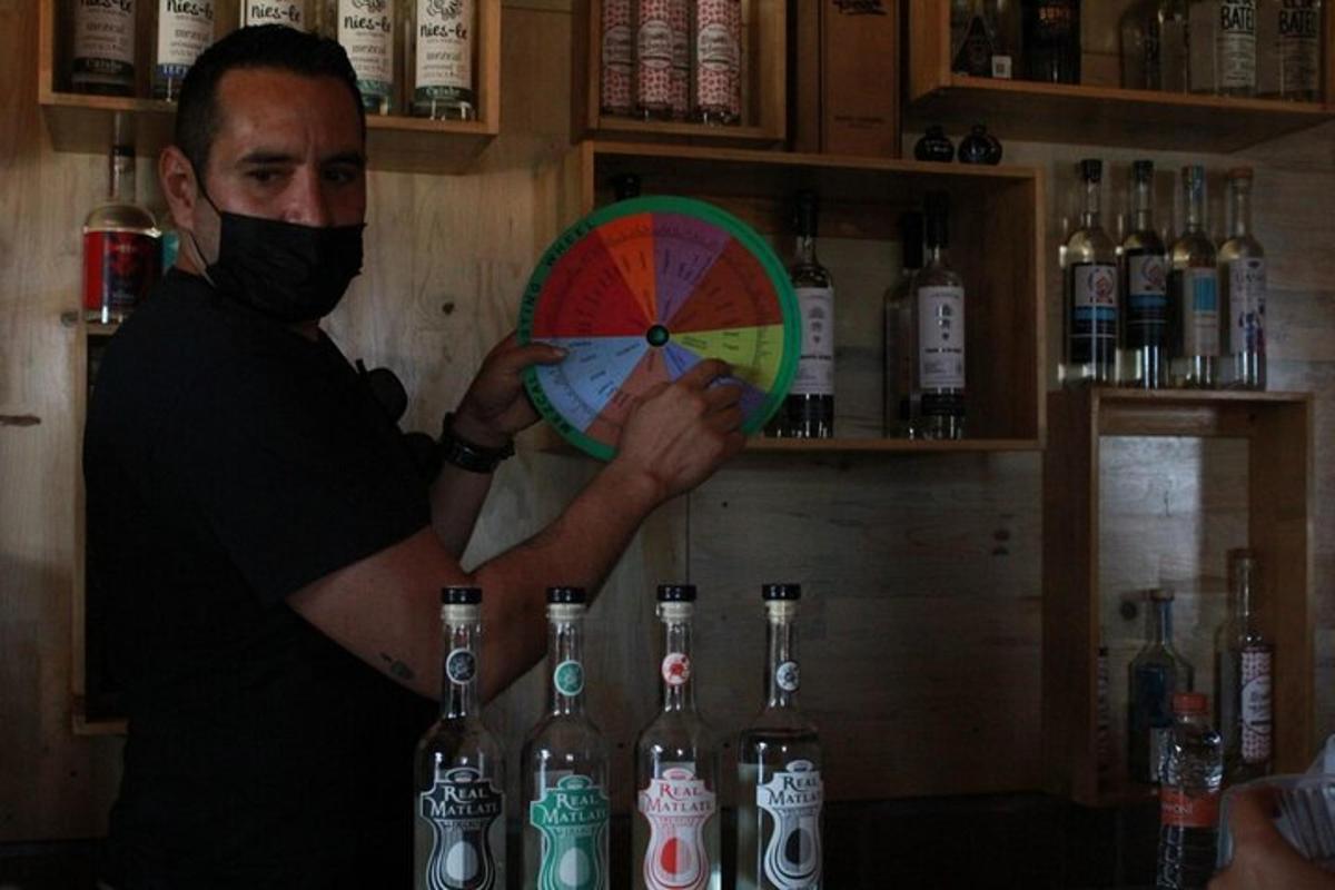 a man in a mask holding a fan in a bar
