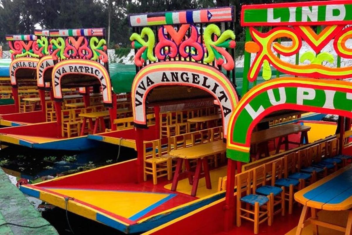 a carnival ride with tables and chairs on the water