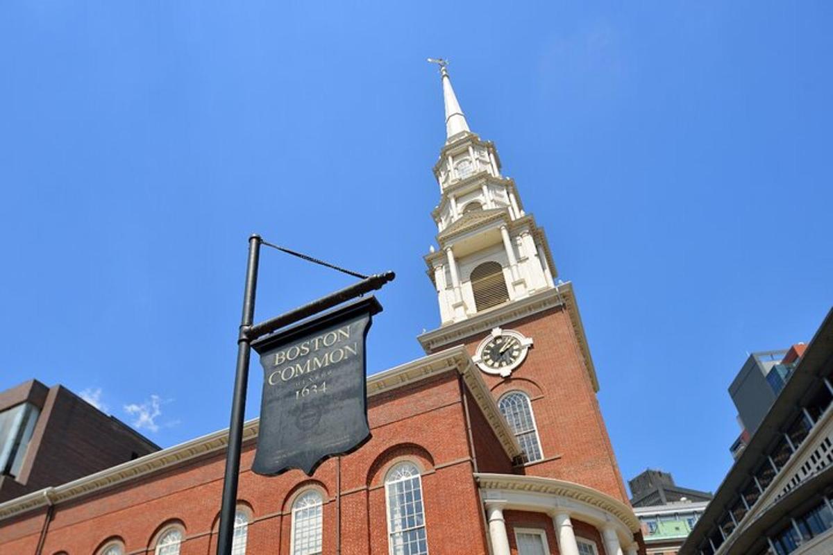 a building with a clock tower with a sign on it