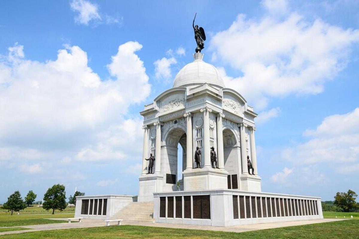 a white building with a statue on top of it