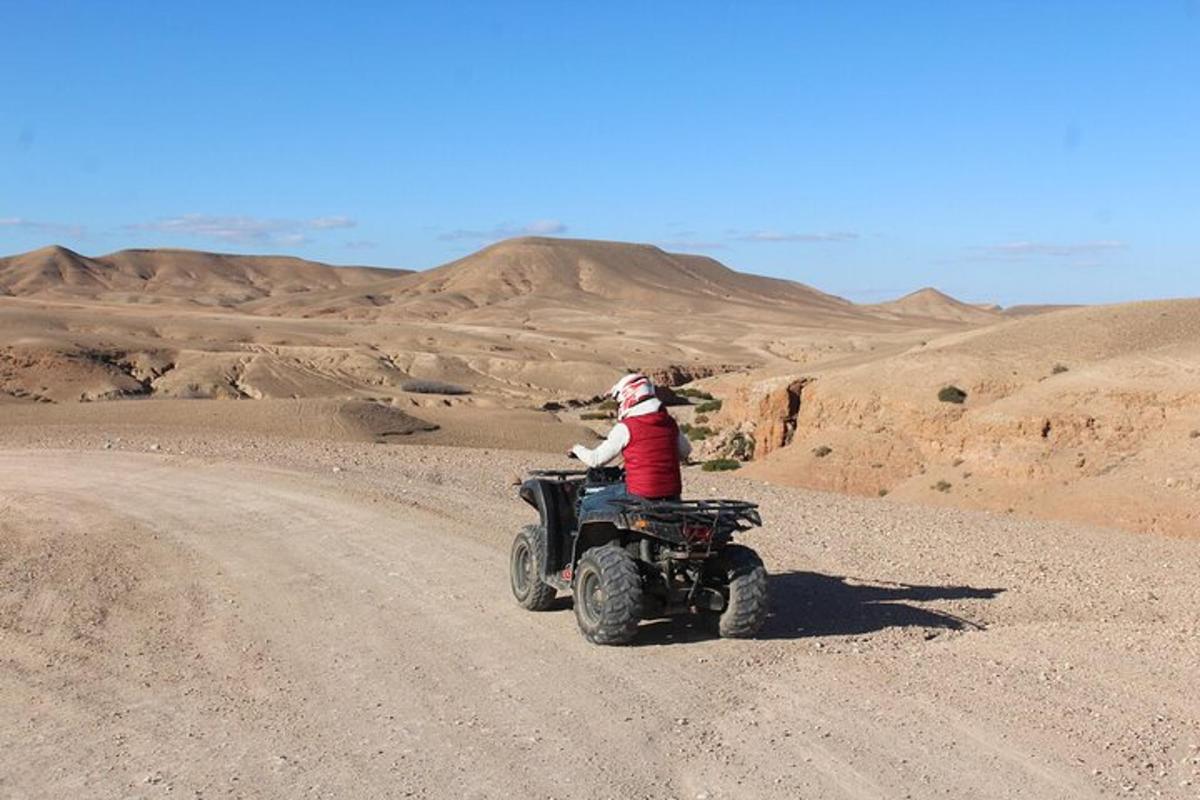 a person riding a four wheeler in the desert