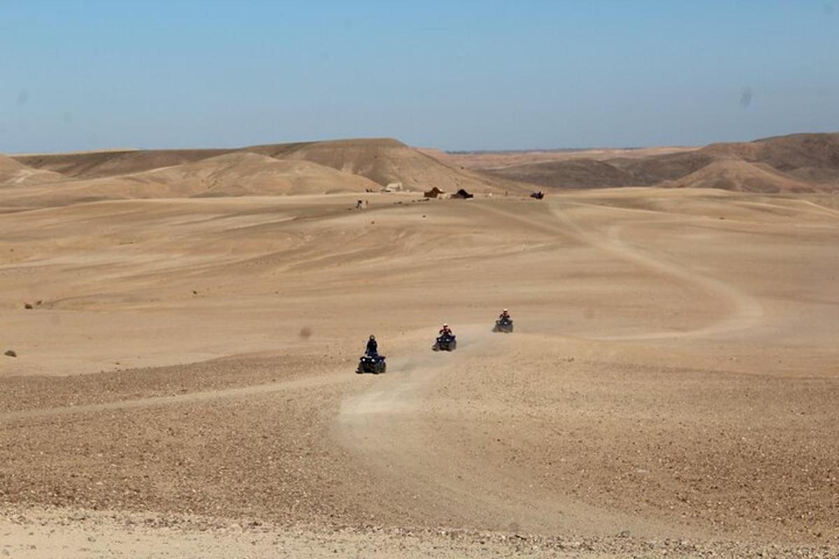 a group of people riding motorcycles in the desert