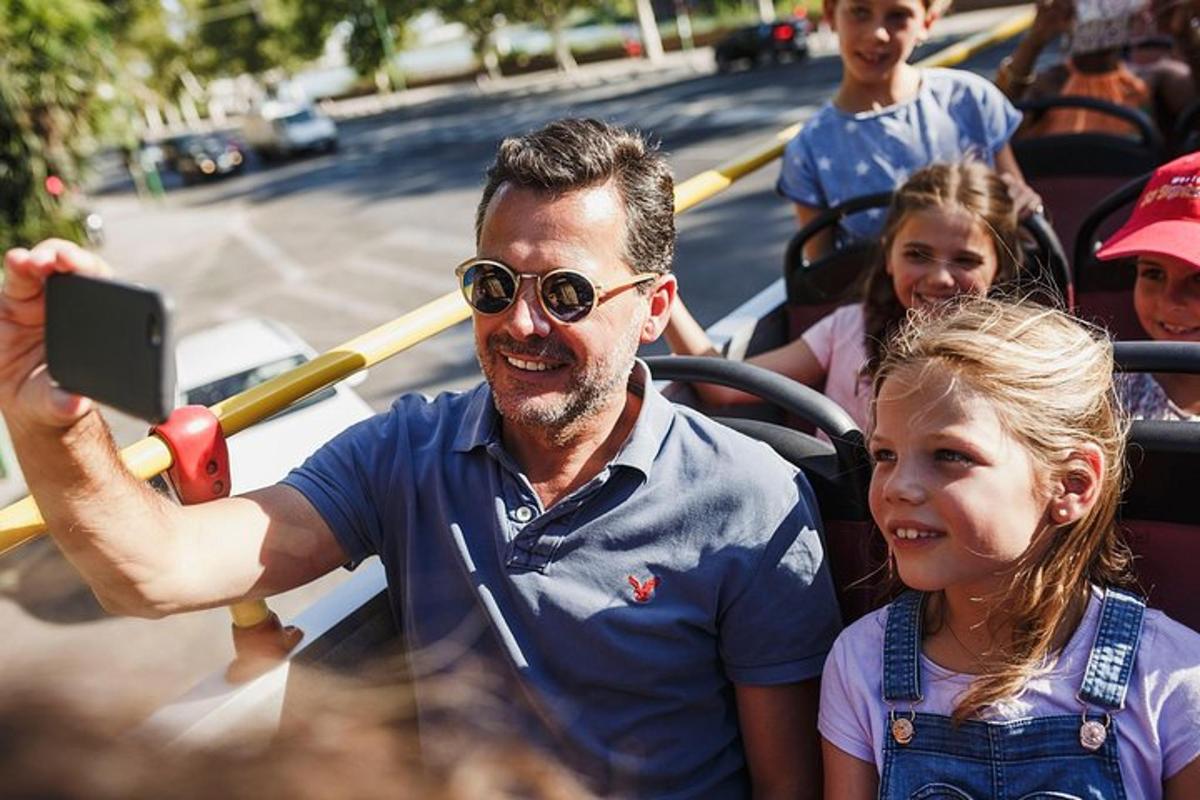 a man is taking a picture of a little girl