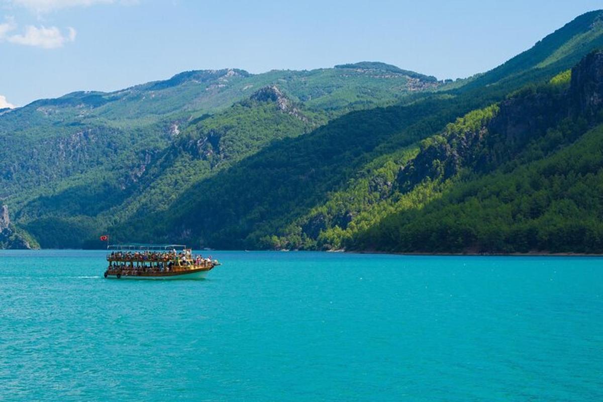 a group of people on a boat in the water