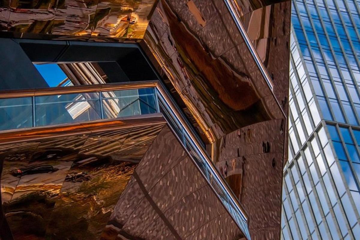 a reflection of a building in a glass window