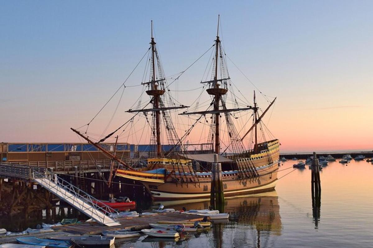 a large boat docked next to a dock