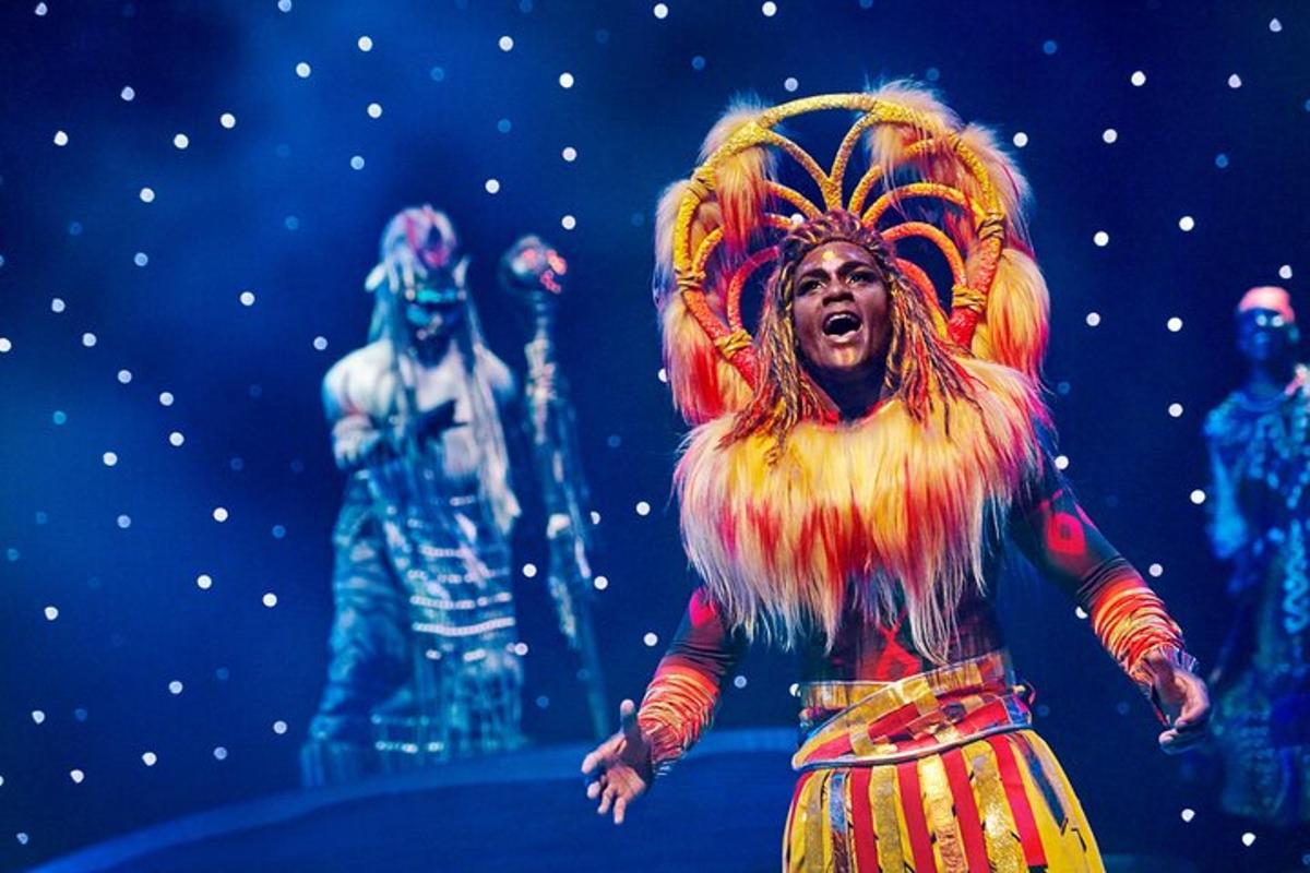 a woman is singing in a performance on a stage