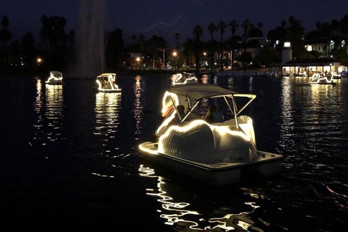 a white boat in the water at night
