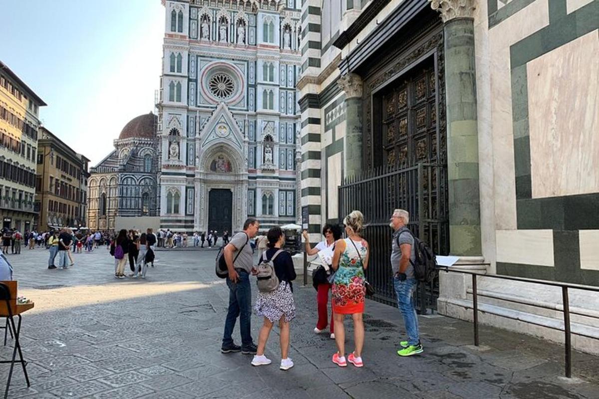 a group of people standing in front of a cathedral