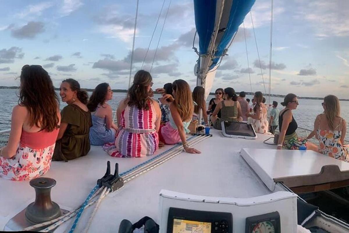 a group of people sitting on a boat