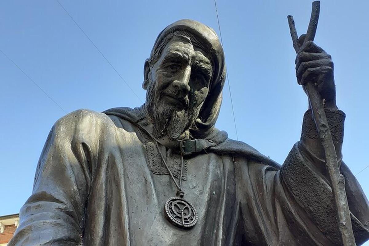 a statue of a man holding a spear