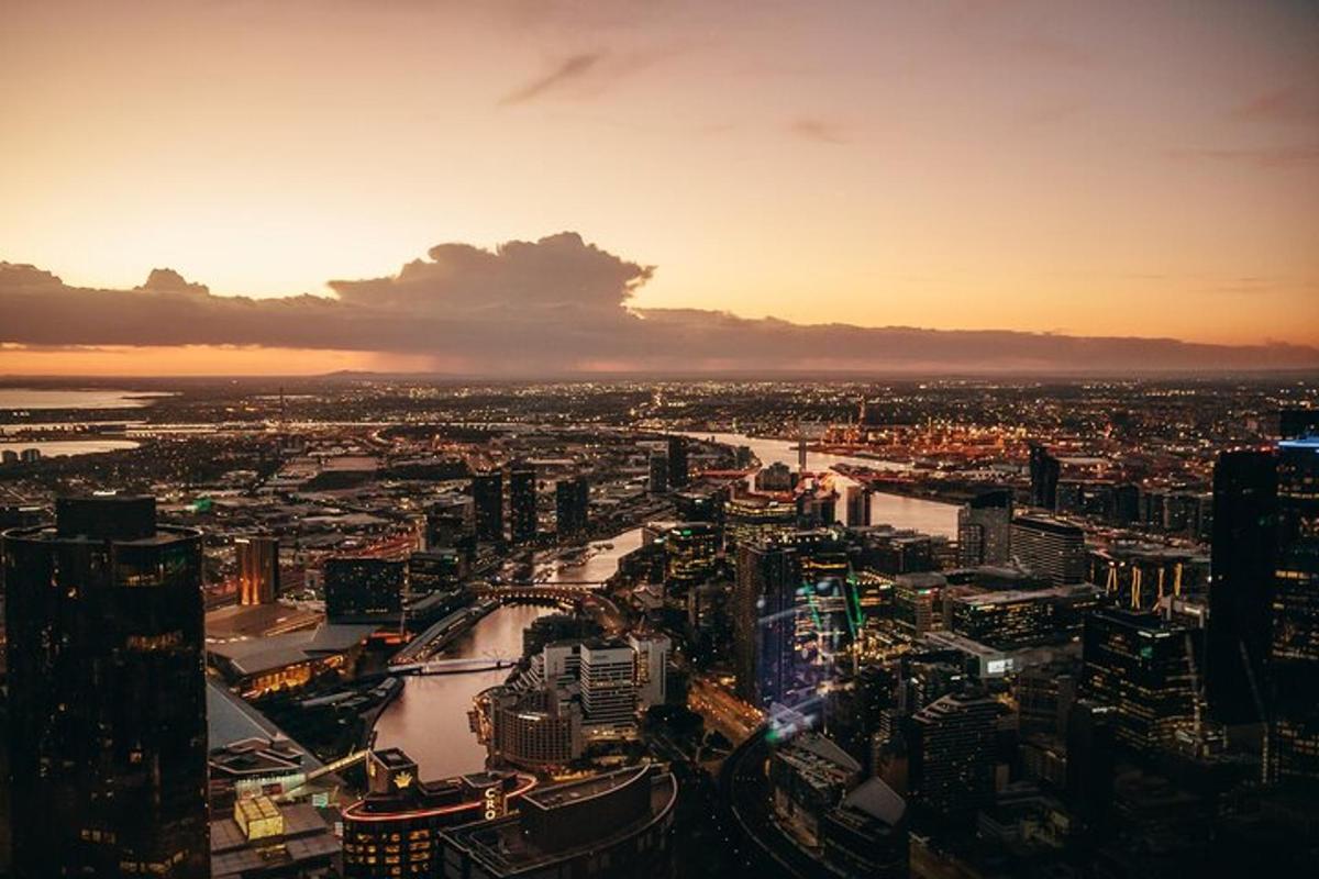 an aerial view of a city at sunset