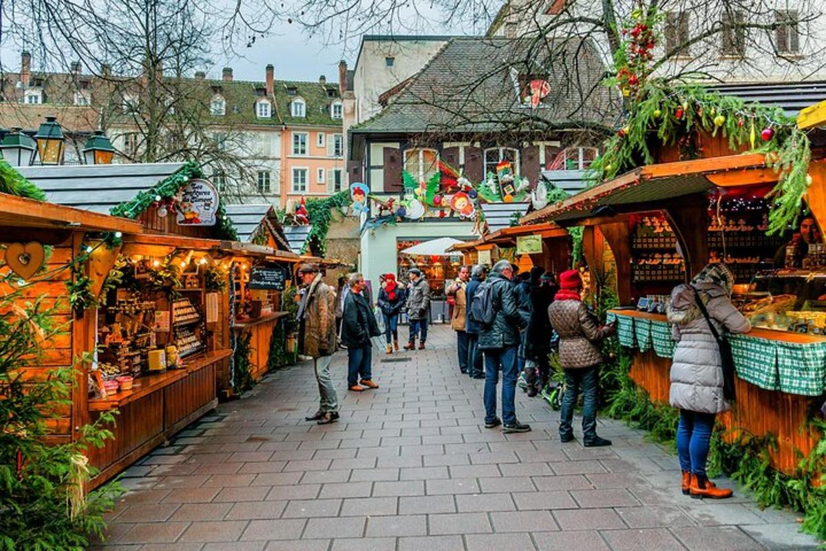 a group of people walking through a christmas market