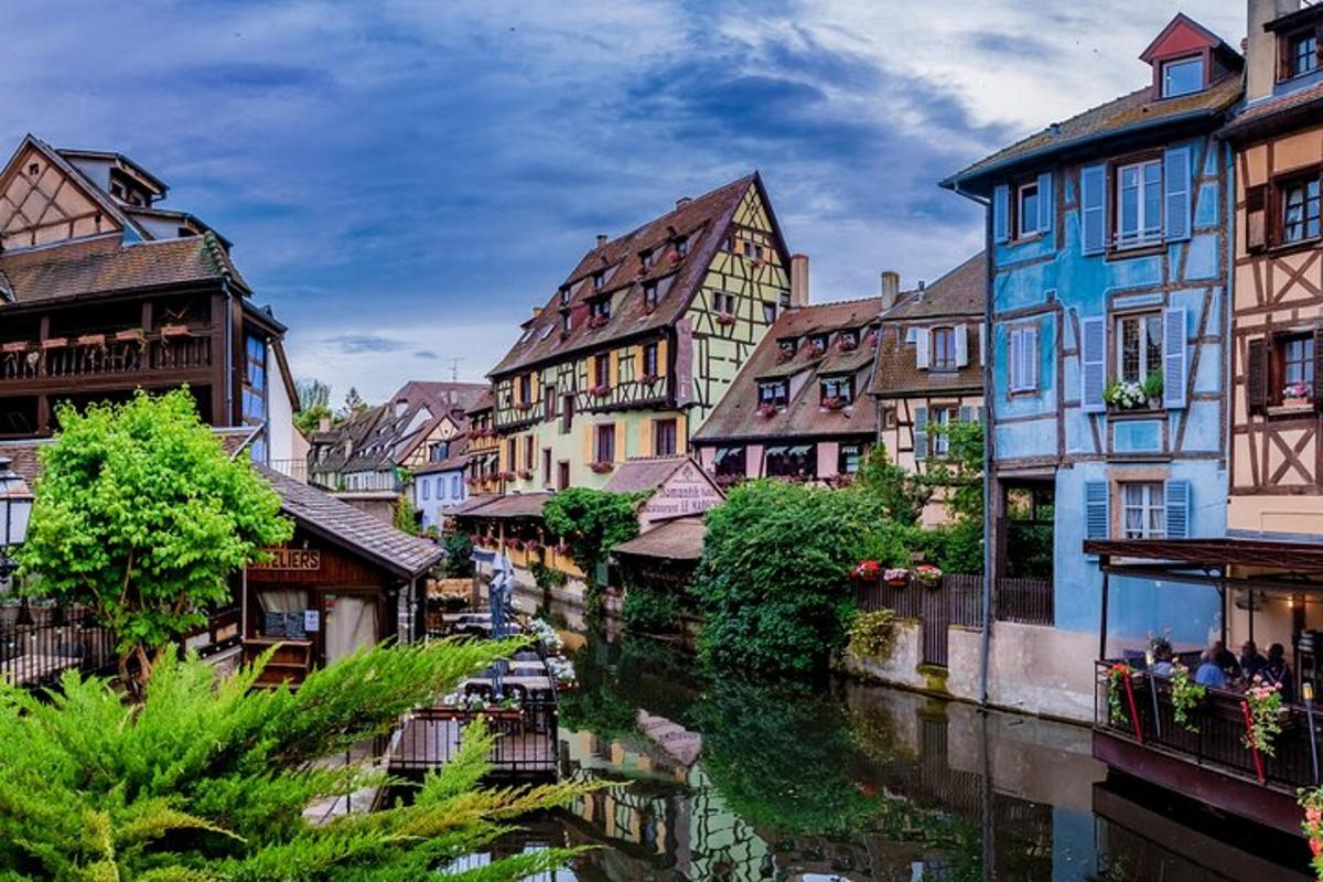 a group of buildings next to a river