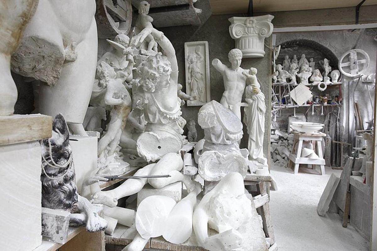 a room with a bunch of vases and a dog