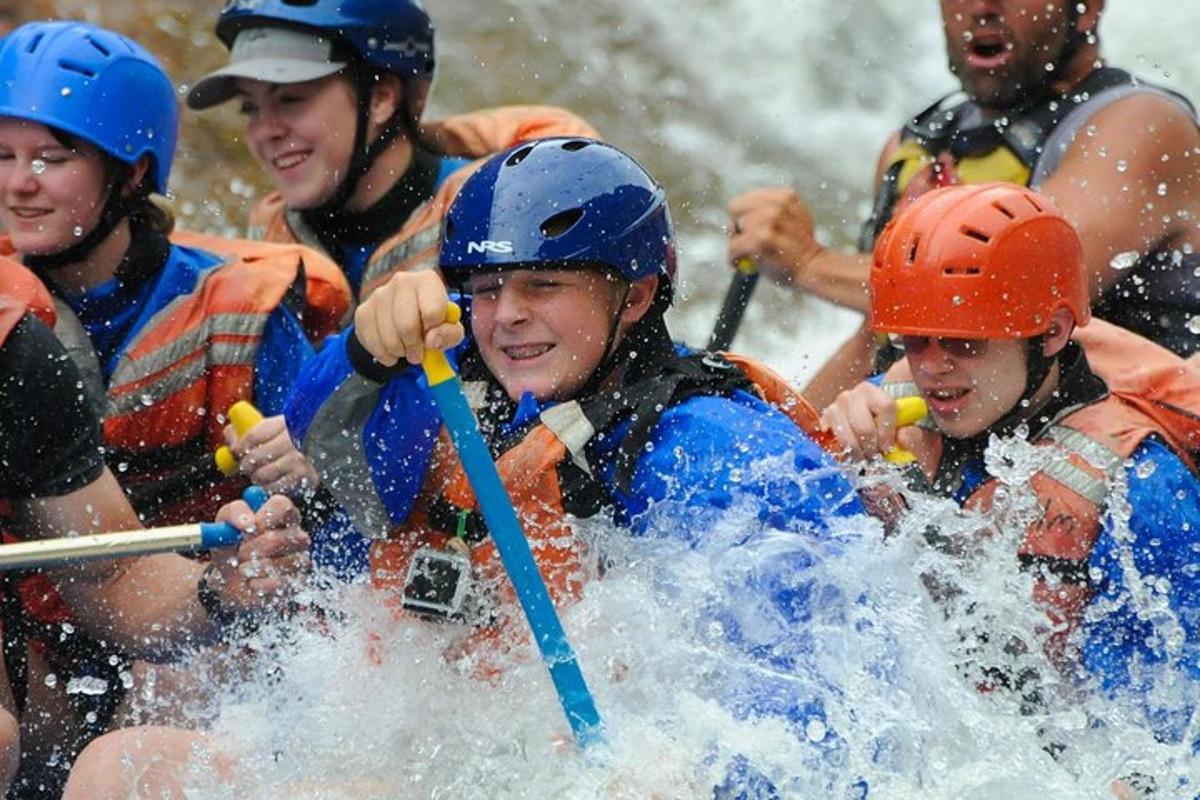 a group of people rafting in a river