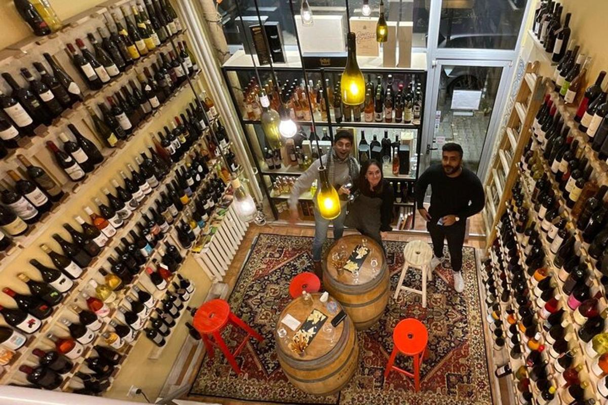 a group of people standing in a wine bar