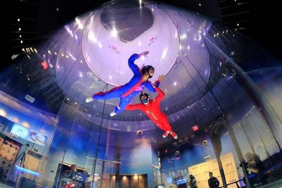 two people are in a ball on a stage