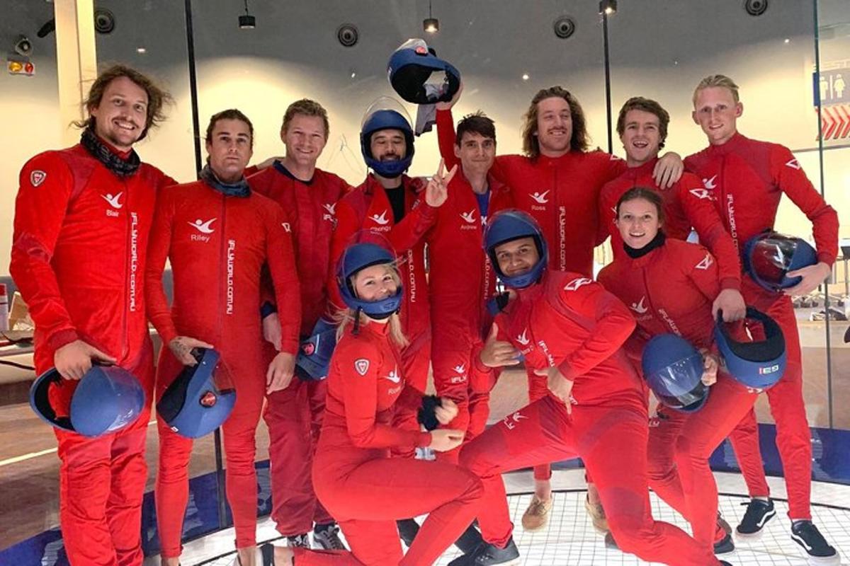 a group of people in red suits posing for a picture