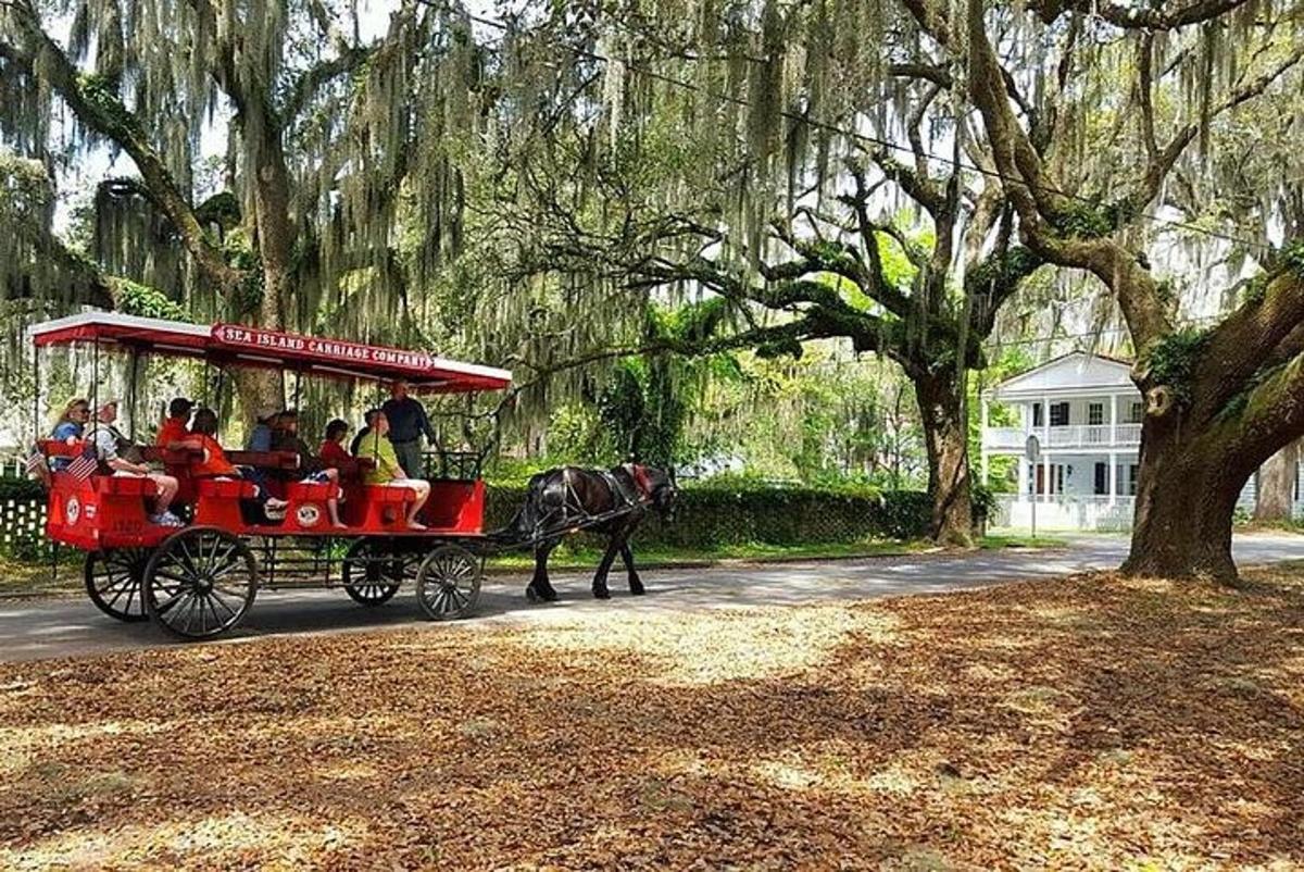 a horse pulling a red carriage with people
