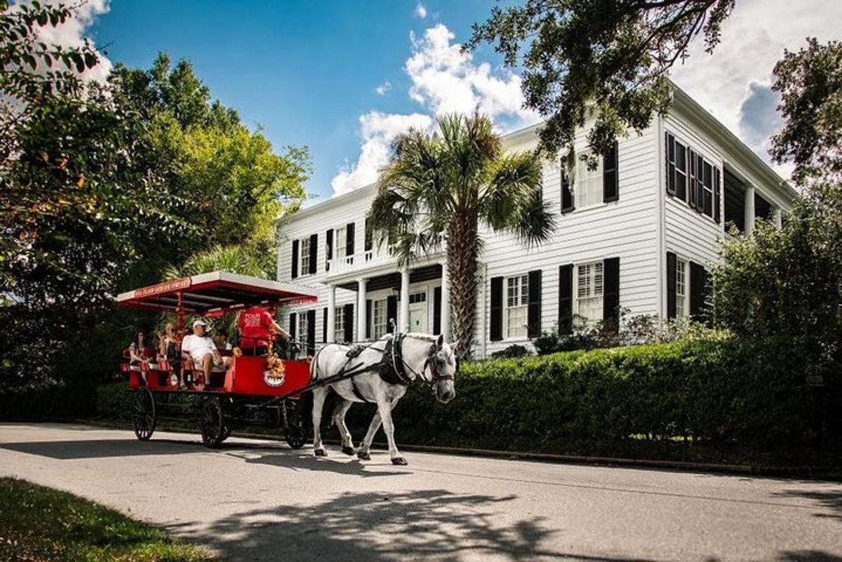 a horse drawn carriage in front of a house