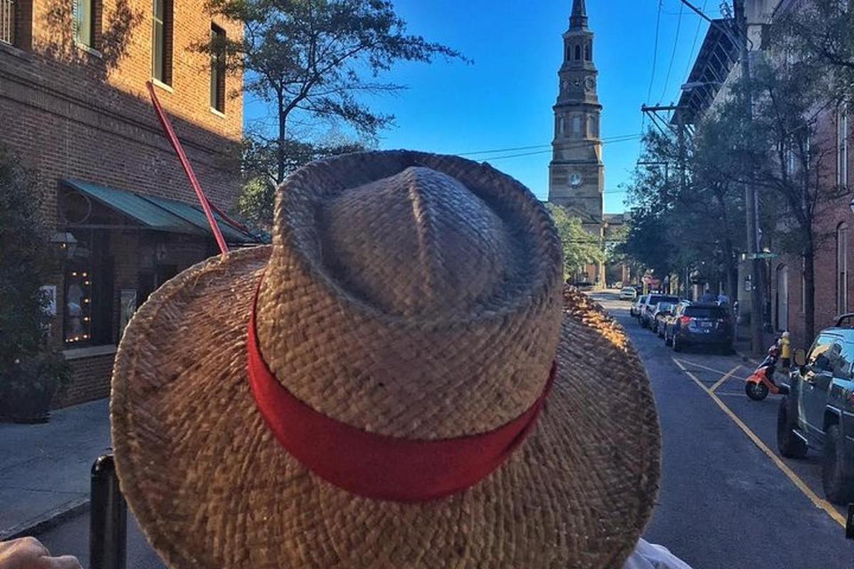 a person wearing a straw hat on a city street