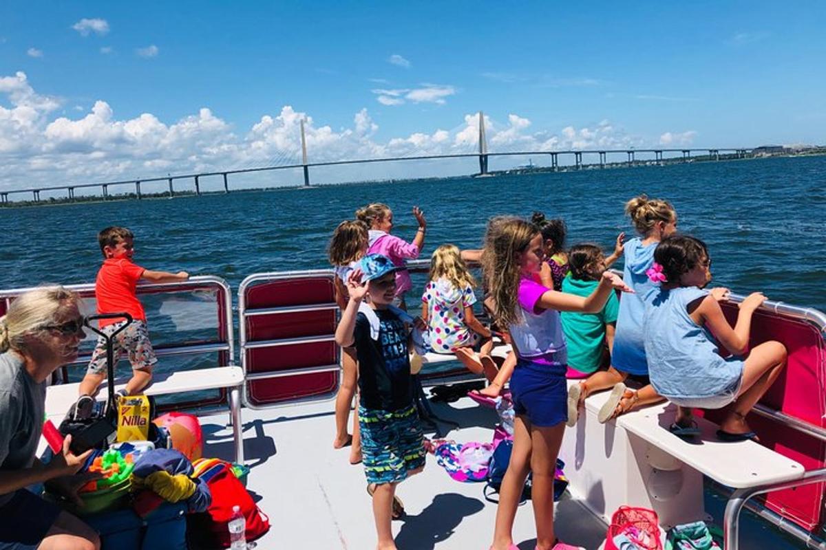 a group of children on a boat in the water