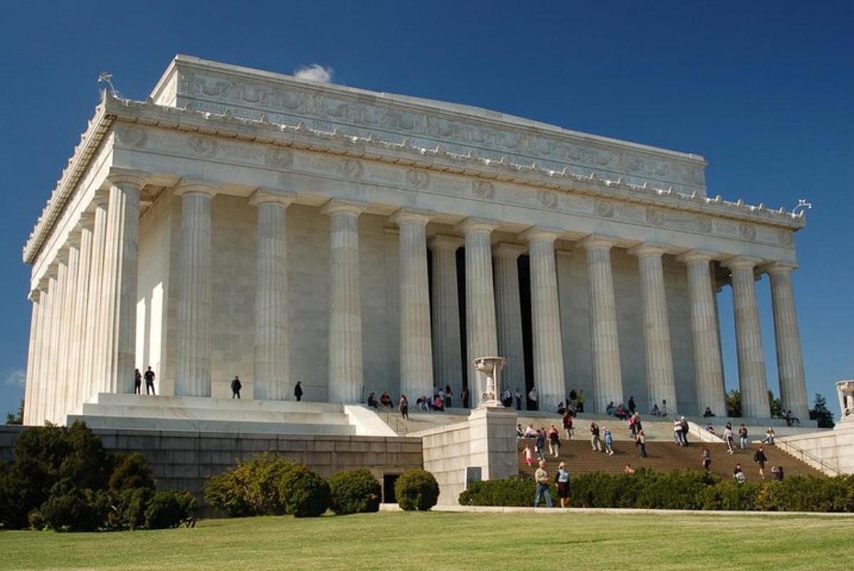 a large building with people walking in front of it