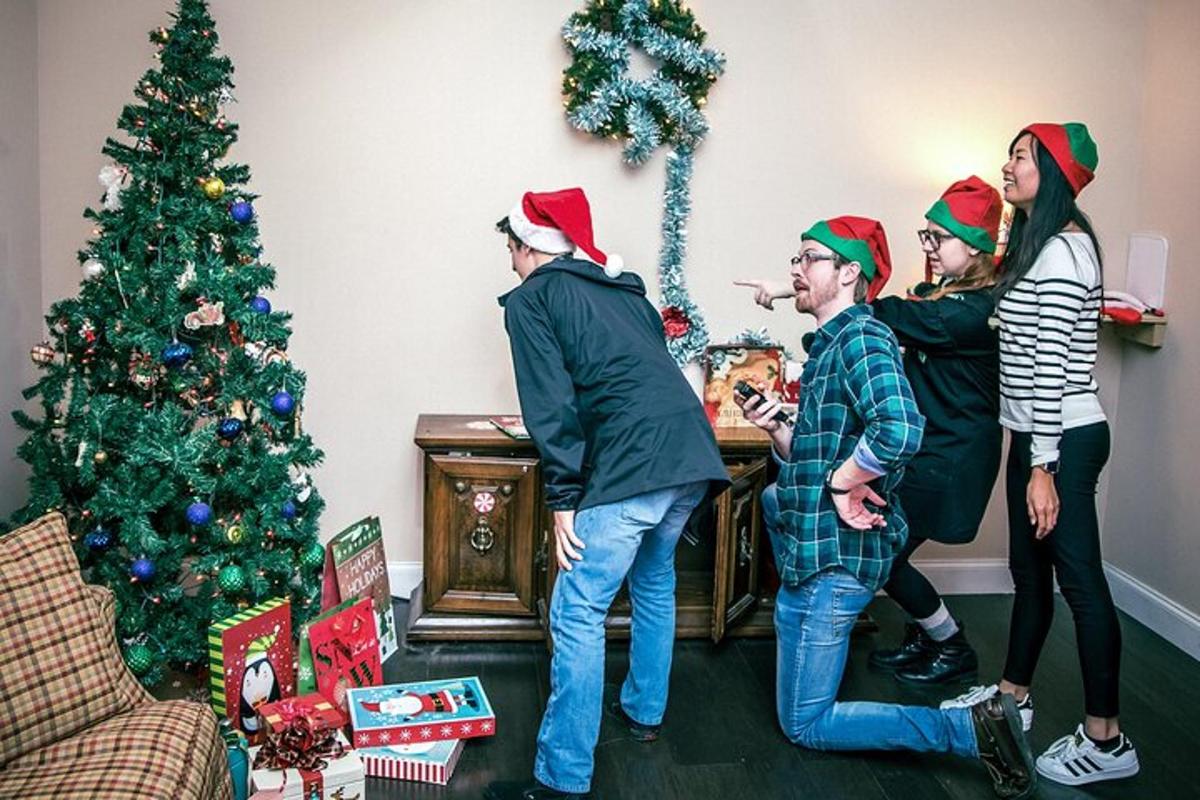 a group of people wearing christmas hats in front of a christmas tree