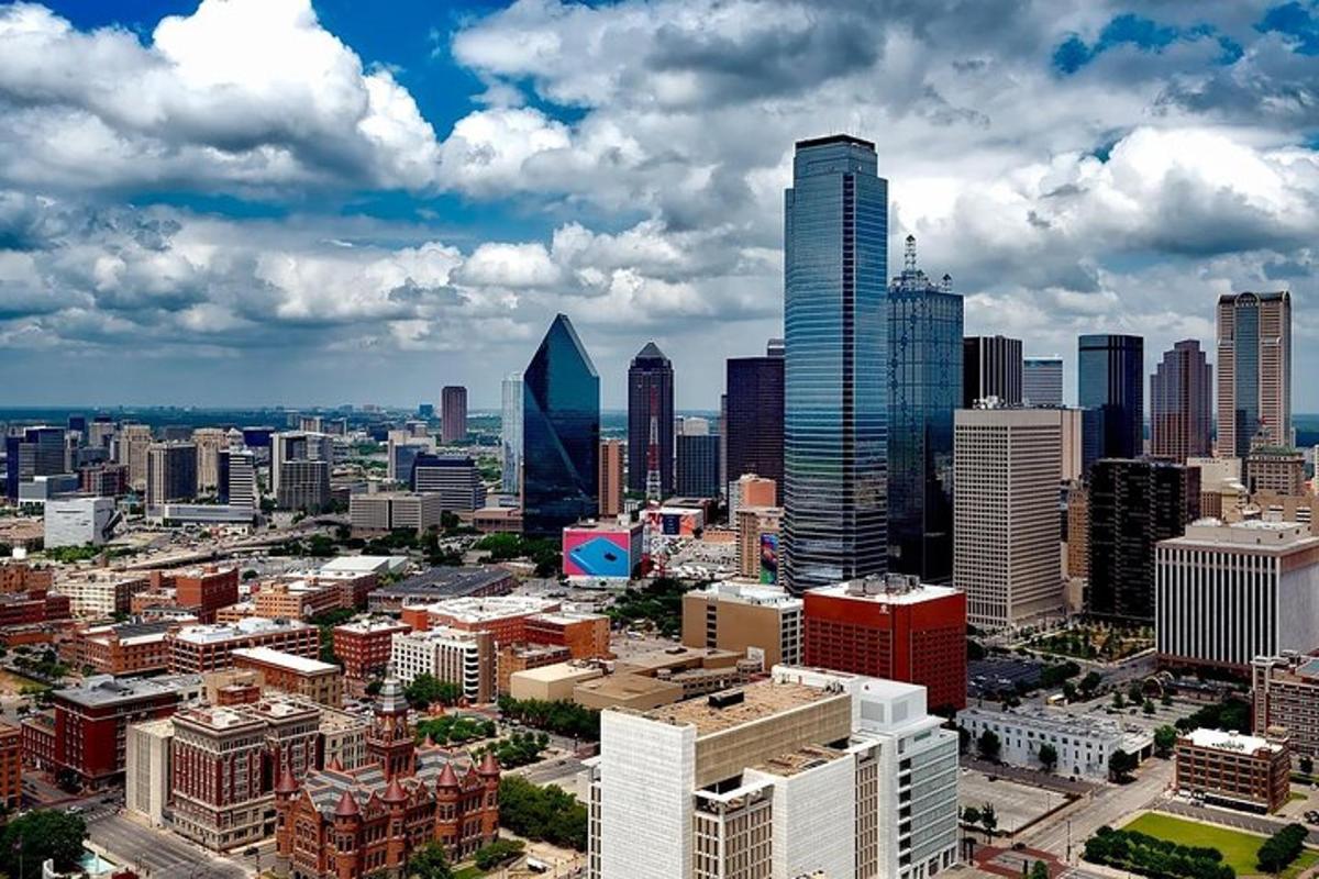 an aerial view of a city with tall buildings