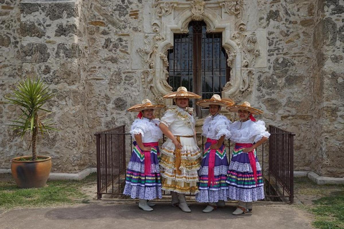 a group of women standing in front of a building