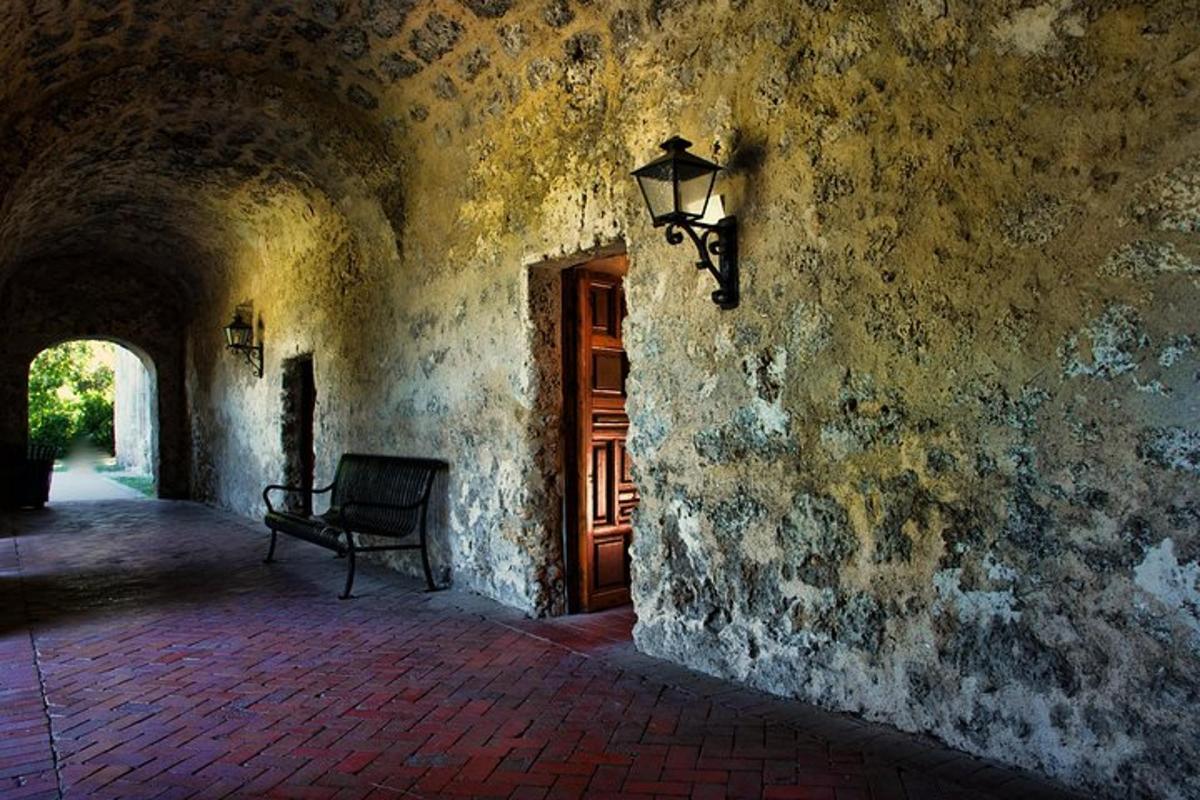 a building with a lamp and a chair next to a door