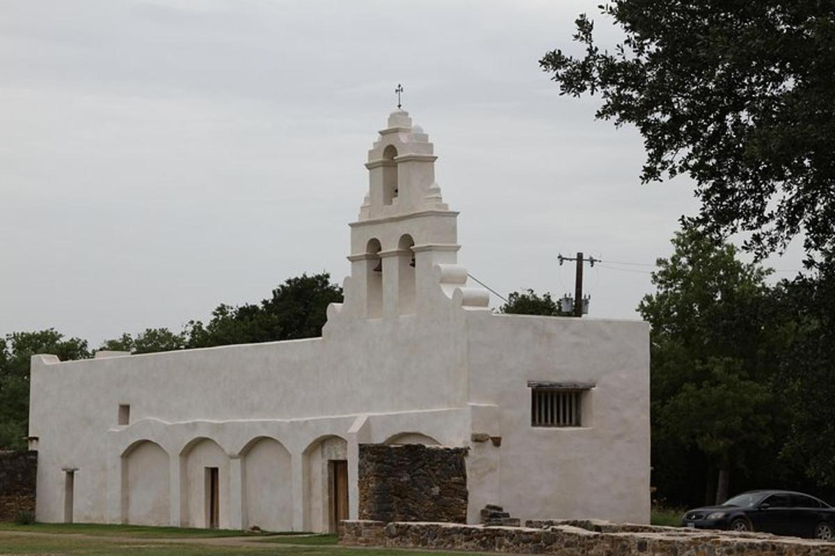 a white church with a cross on top of it