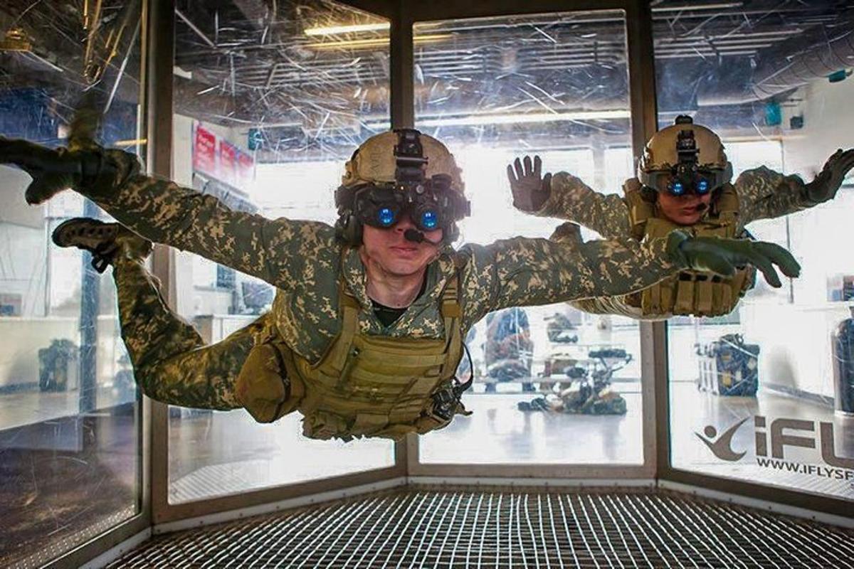 two soldiers in uniform are in a display window