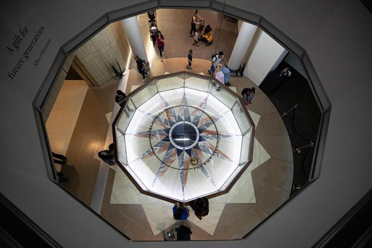 an overhead view of a clock in a building