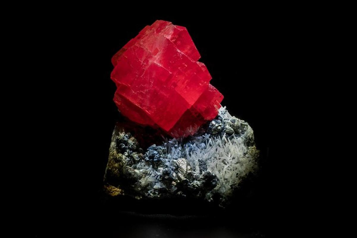 a large red gemstone on a black background
