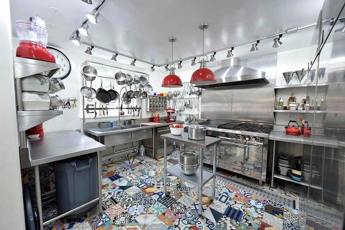 a large commercial kitchen with a tile floor