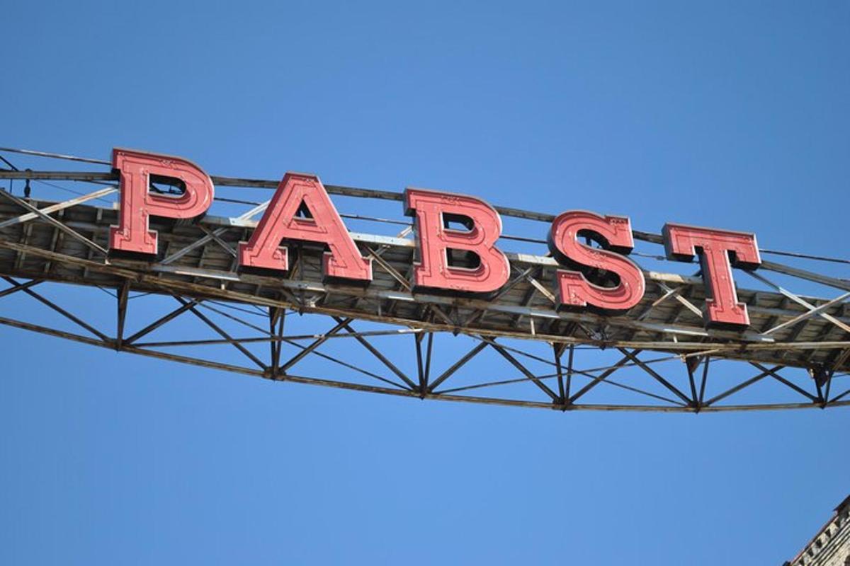 a large red sign on top of a metal structure