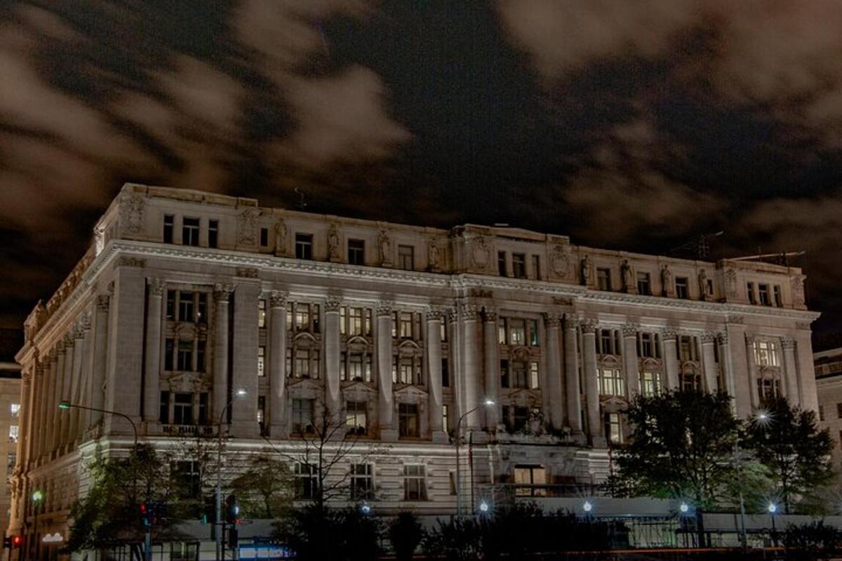 a large white building with lights on it at night