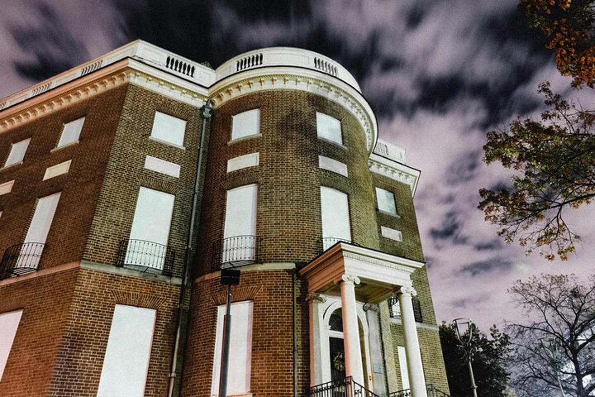 a tall brick building with a sky in the background