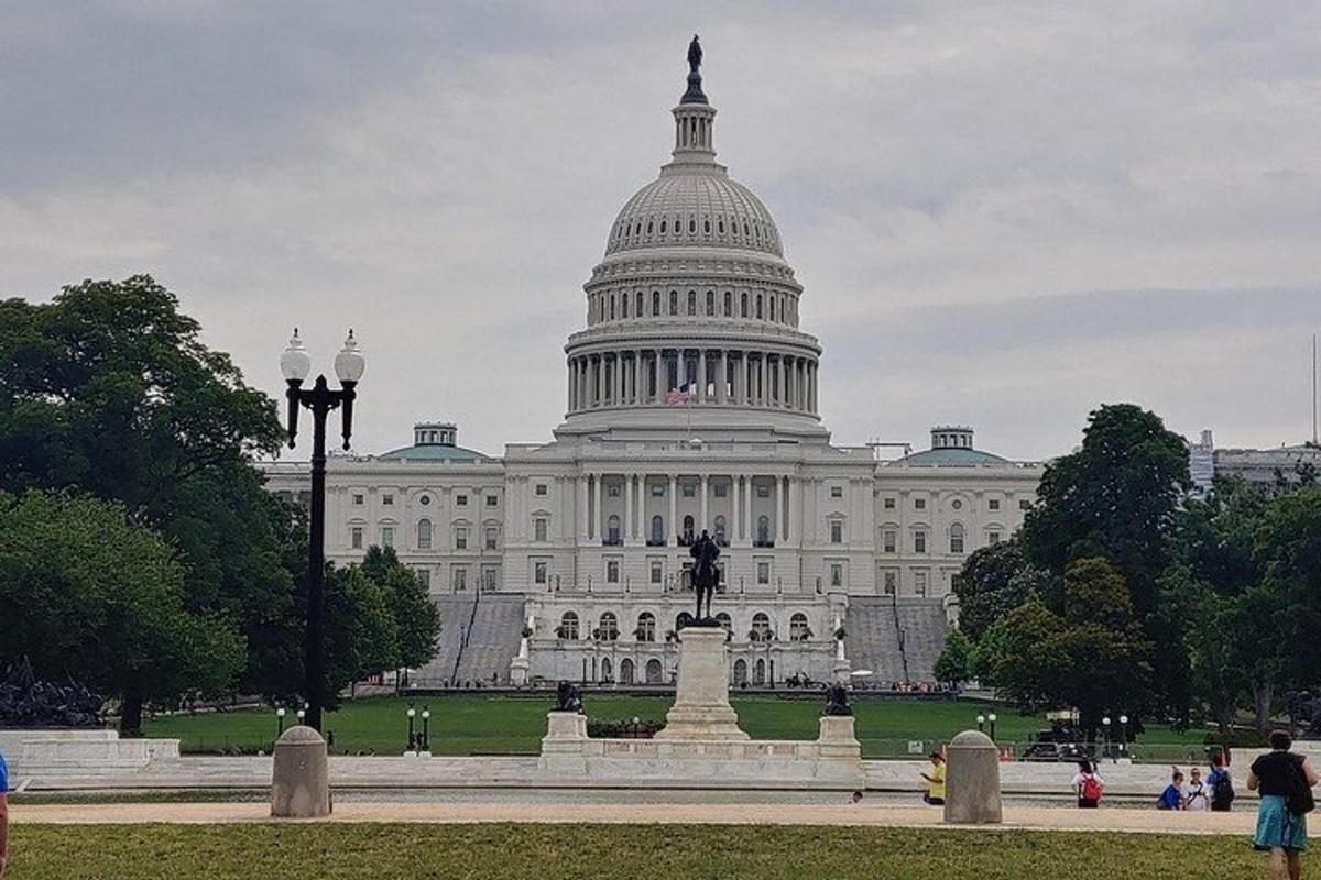 the capitol building with a statue in front of it