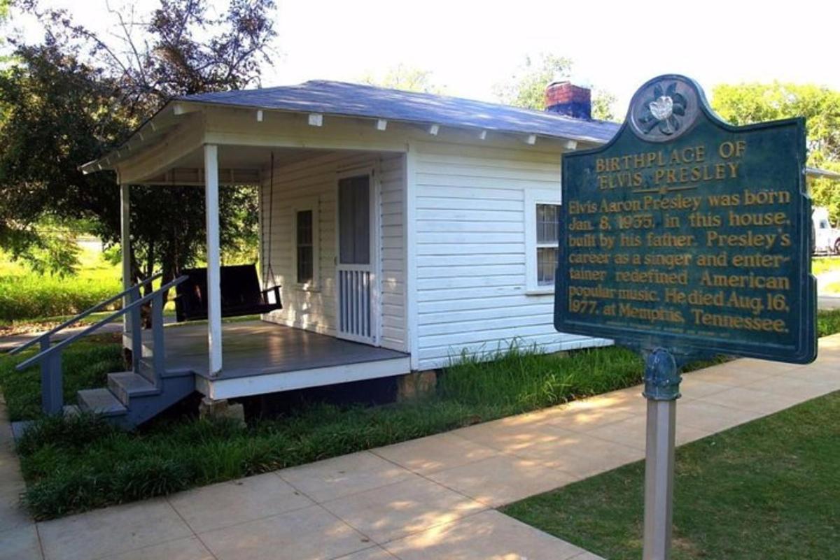a small building with a sign in front of it