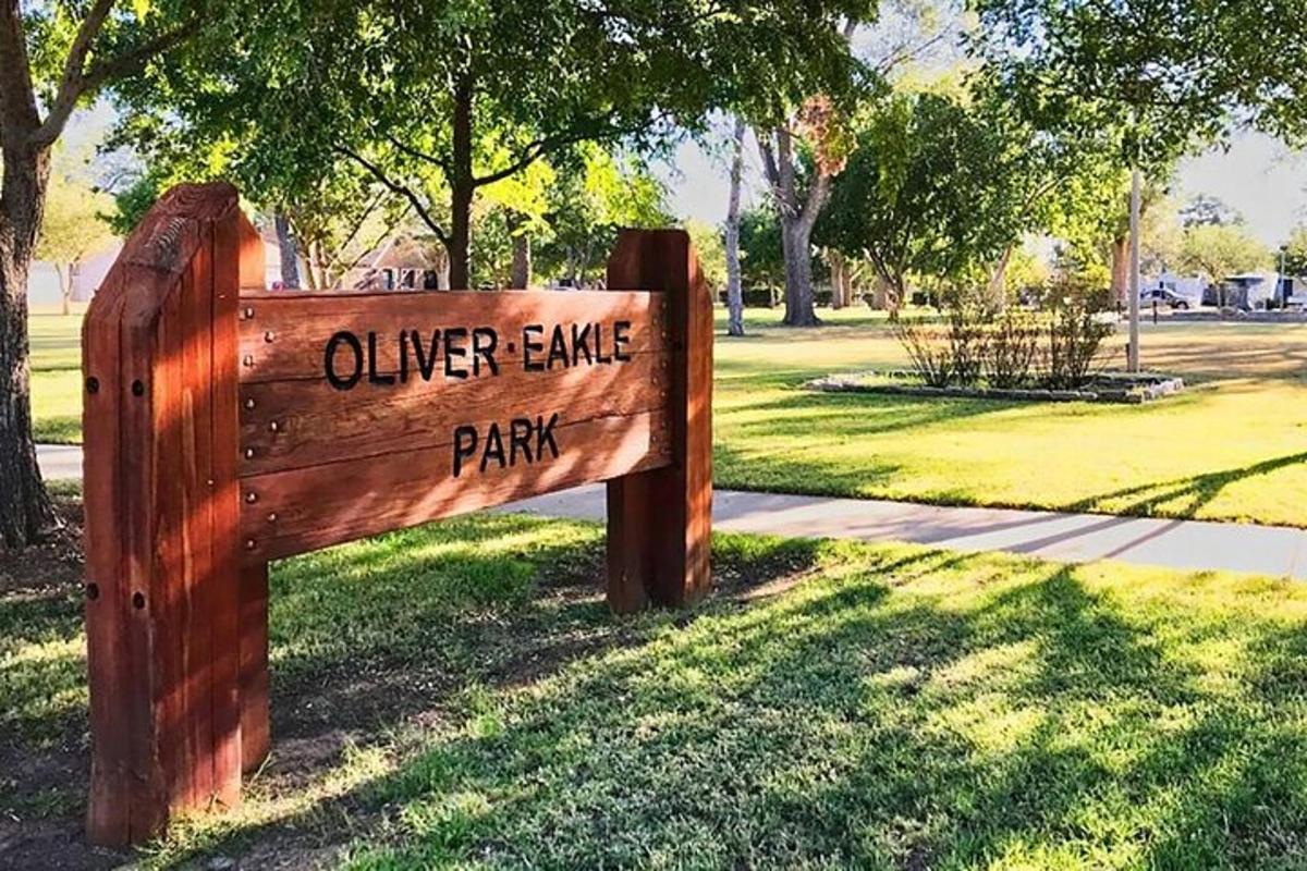 a wooden sign that says oliver cape park