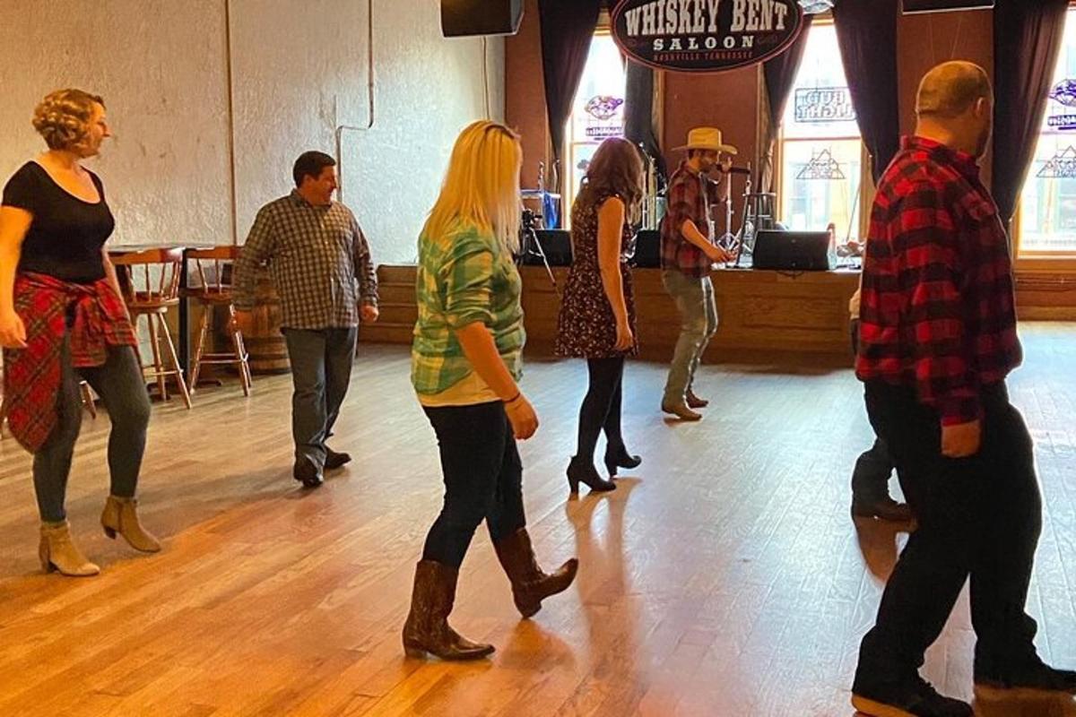 a group of people dancing on a dance floor