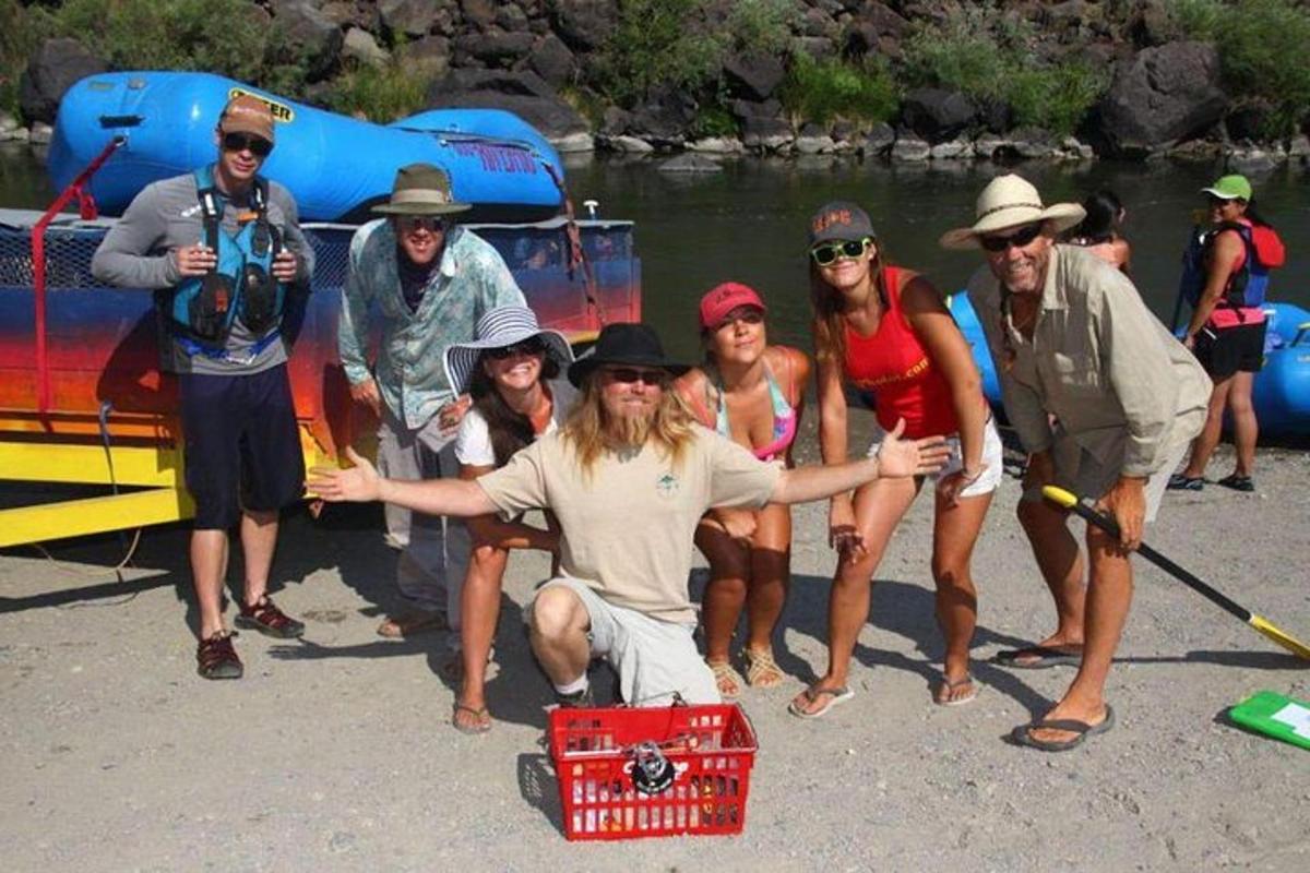 a group of people posing in front of a boat