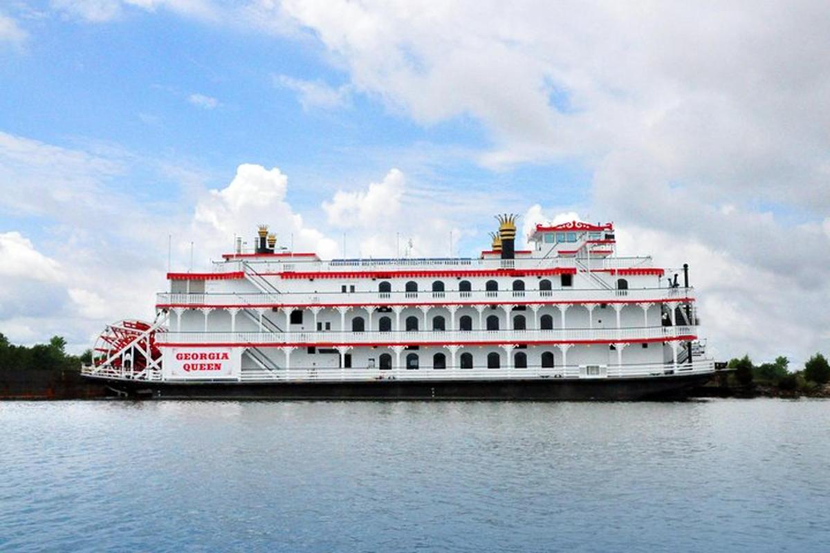 a large white cruise ship on the water