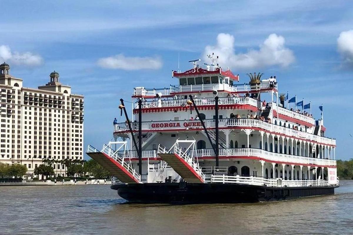 a cruise ship in the water next to a building